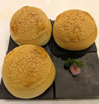 Three Pineapple crisp bread on the black plate Stock Photos