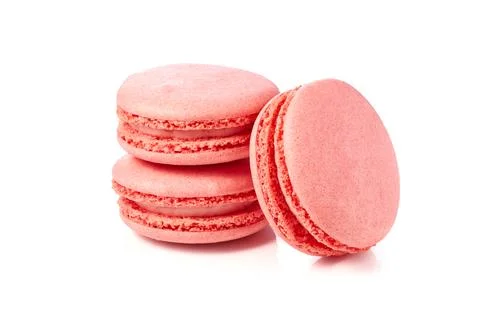 Three pink macaroons on white background Stock Photos