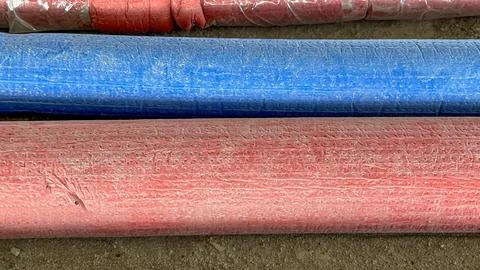 Three pipes are shown in different colors, with one being red, one blue Stock Photos