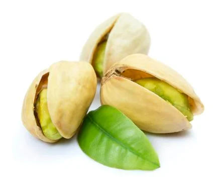 Three pistachio nuts with leaf Stock Photos