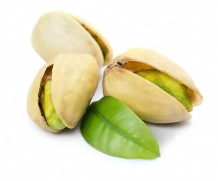 Three pistachio nuts with leaf Stock Photos
