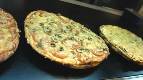 Three pizzas on the table. 動画素材 86702141