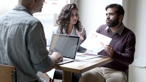 Three planners discussing new project Stock Footage 121002374
