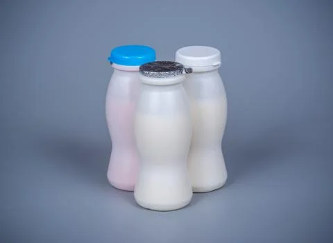 Three plastic bottles with yogurt Stock Photos
