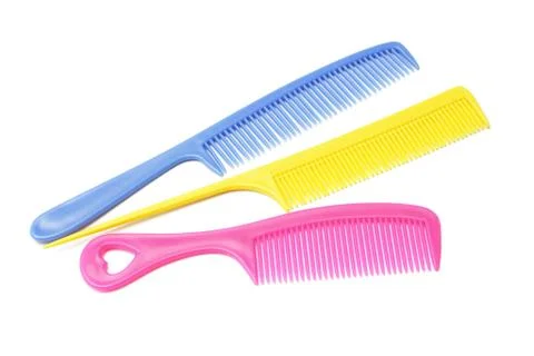 Three plastic combs with handles Stock Photos