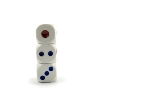Three plastic dice isolated on a white background, a dice is a small object Stock Photos