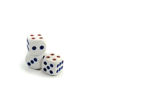Three plastic dice isolated on a white background, a dice is a small object Stock Photos