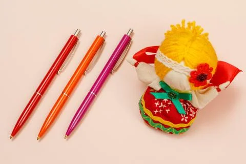 Three plastic pens on a beige background. Stock Photos