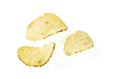 Three plates of potato chips on a white background close-up Stock Photos