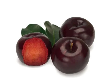 Three plums with leaves on white background Stock Photos