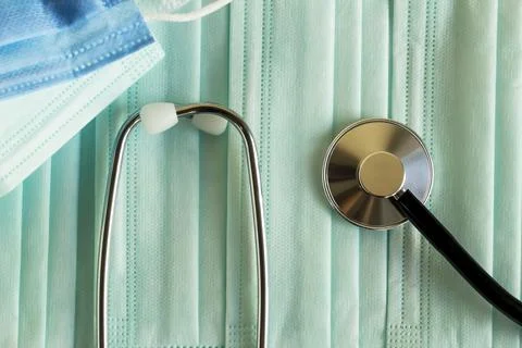 Three ply structure,single use hygenic face masks with stethoscope,background Stock Photos