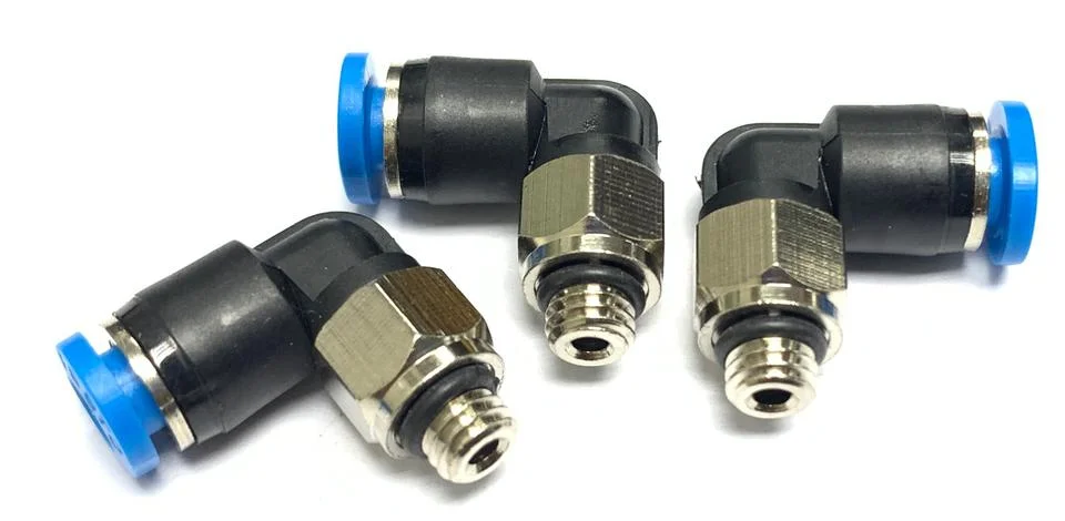 Three pneumatic elbow connectors with threaded metal Stock Photos