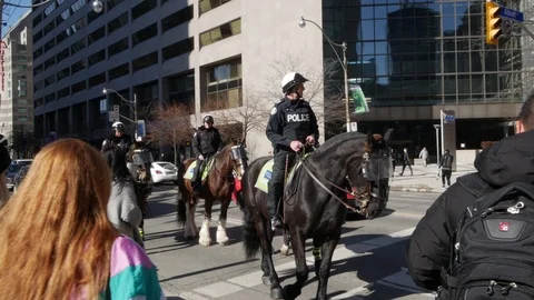 Three Police Officers Mounted on Horses Stock Footage