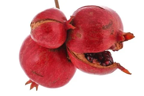 Three pomegranate on the white background Stock Photos