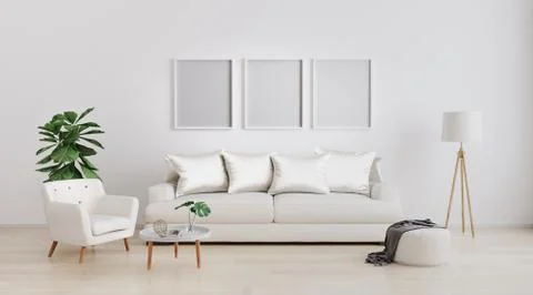 Three poster blank frames in Stylish interior of bright living room with whit Stock Photos