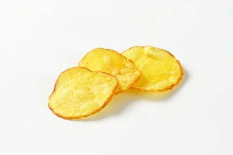 Three potato chips on white background Stock Photos