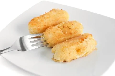 Three potato croquettes with fork Stock Photos
