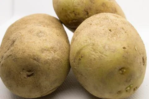 Three potatoes isolated on a White background Stock Photos