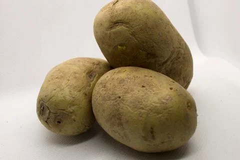 Three potatoes isolated on a White background Stock Photos