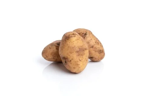 Three potatoes isolated on a white background. Root vegetable. Stock Photos