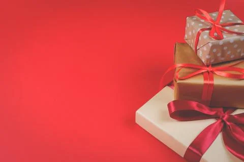 Three presents on red background. Stock Photos