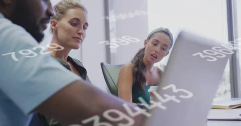 Three professionals analyzing numeric data on laptop in conference room with 스톡 사진