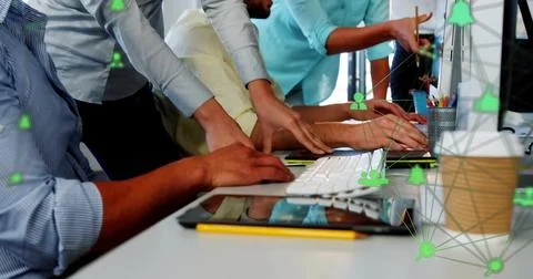 Three professionals are collaborating on flat design at desk with network Stock Photos