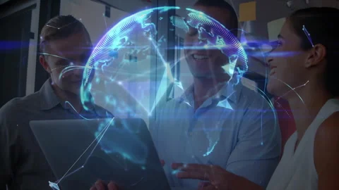 Three professionals working on laptop in tech office, interacting with Stock Footage 307466890