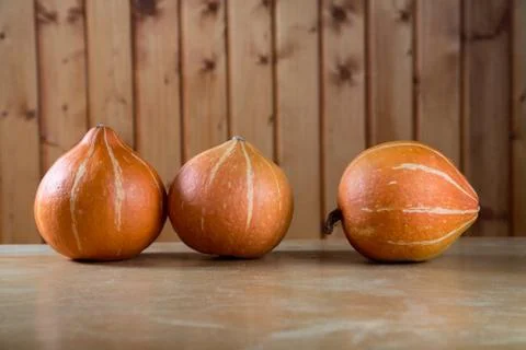 Three pumpkins abreast on  table Stock Photos