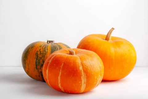 Three pumpkins isolated on white background Stock Photos
