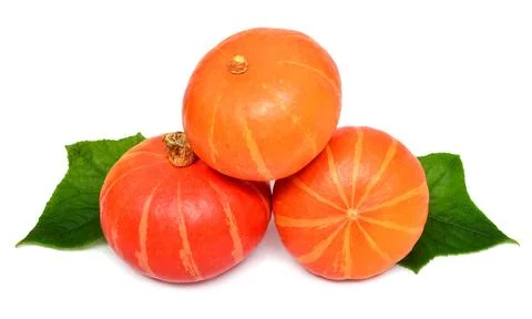 Three pumpkins with leaves isolated on white background Stock Photos