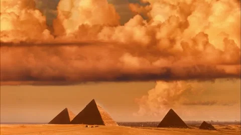 Three Pyramids Under Dramatic Orange Sky with Massive Clouds Stock Footage 321124929