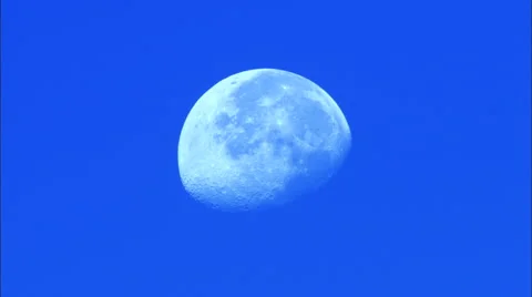 Three Quarter (3/4) Moon Time Lapse in Blue High Contrast Sky HD Video Stock Footage 57975857