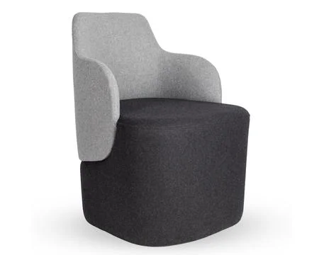 Three quarter view of modern two tone grey upholstered armchair with high back Stock Photos