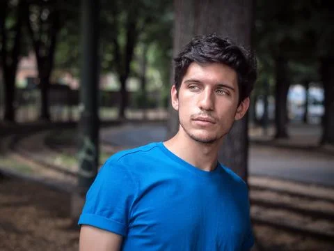 Three quarters shot of one handsome young man in urban setting Stock Photos