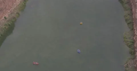 Three Rafts Floating Down a River Stock Footage 65221479