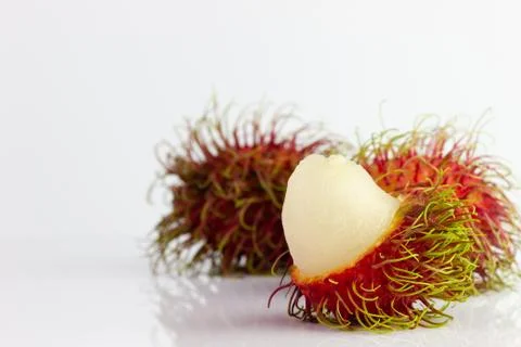 Three rambutans. Stock Photos