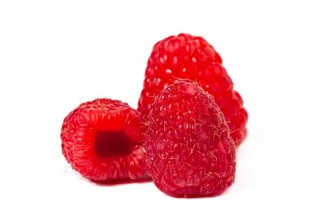 Three raspberries Stock Photos