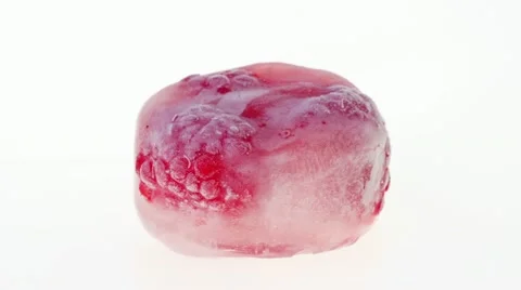 Three raspberry berries inside of melting ice cube, time lapse video Stock Footage 10914234