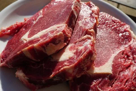 Three raw Beef Steaks Stock Photos