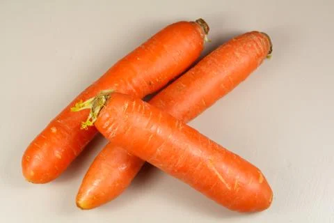 Three raw carrots Stock Photos