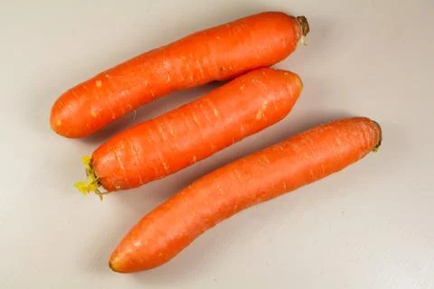 Three raw carrots Stock Photos