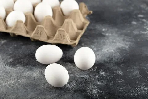 Three raw chicken fresh eggs on a marble background Stock Photos