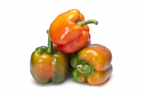 Three raw peppers. Stock Photos