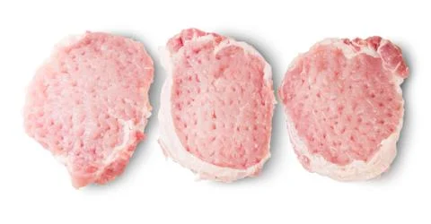Three raw pork schnitzels Stock Photos