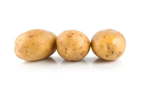 Three raw potatoes isolated on a white Stock Photos
