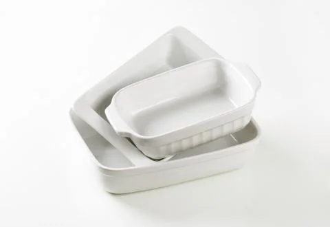 Three rectangular white porcelain baking dishes Fotos de archivo
