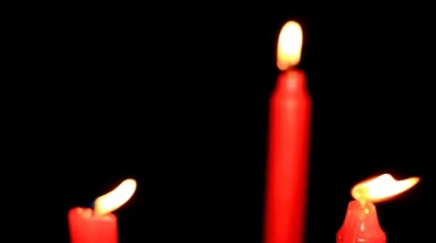 Three red candles on black background Stock Footage 10594420