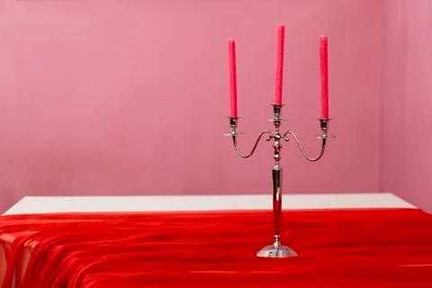 Three red candles in a candlestick Stock Photos