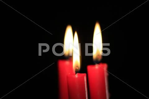 Three red candles Stock Photos